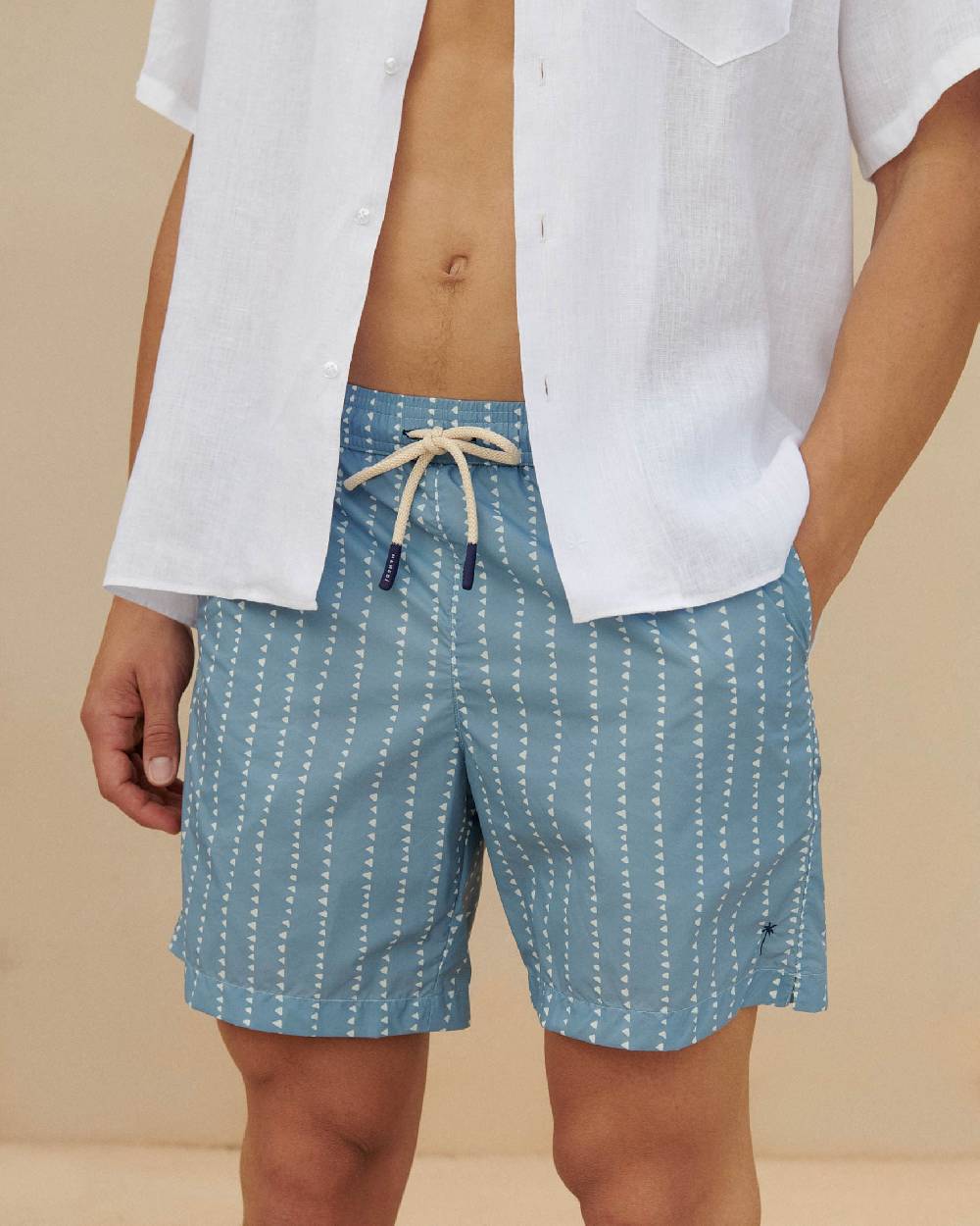 Manebí Printed Swim Shorts - Indigo with White Linear Triangles Vendita Economica
